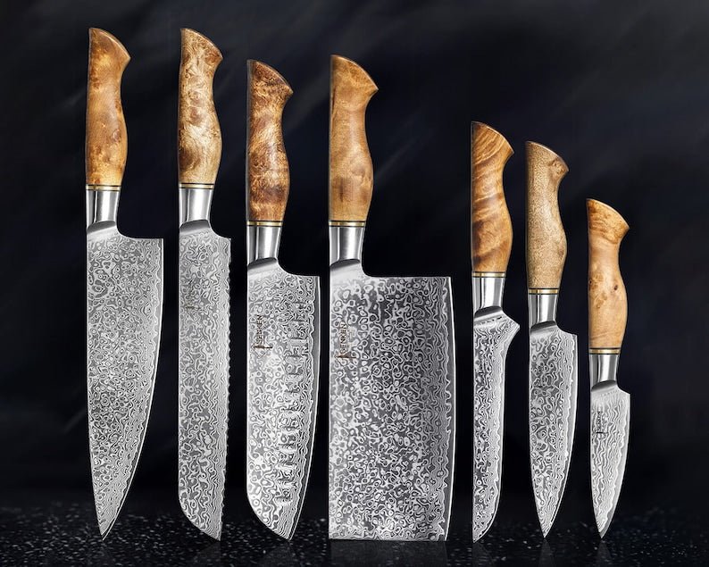 Japanese chef knife set forged from 67-layer Damascus steel with razor sharp blades and traditional ergonomic handles
