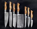 Japanese chef knife set forged from 67-layer Damascus steel with razor sharp blades and traditional ergonomic handles
