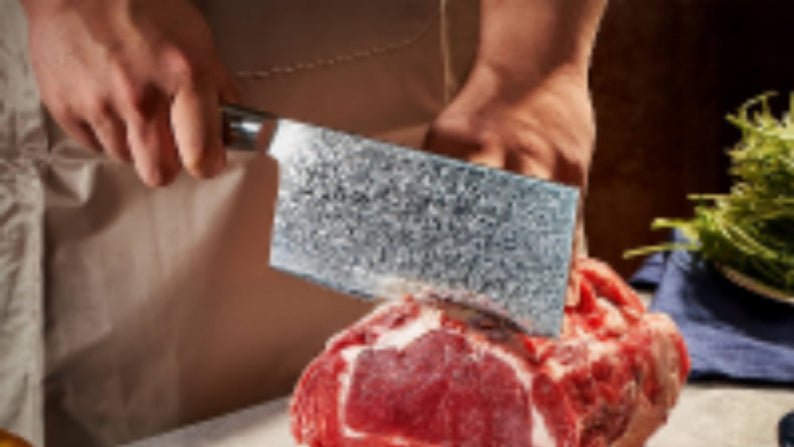 Person cutting raw meat on a wooden board with various ingredients around