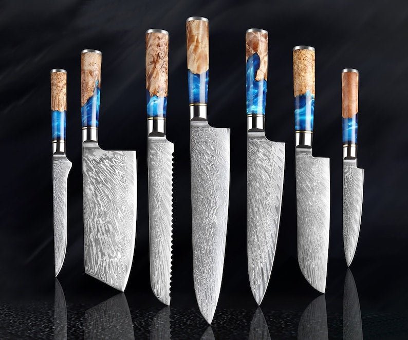 Japanese chef knife set forged from 67-layer Damascus steel with razor sharp blades and traditional ergonomic handles

