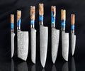 Japanese chef knife set forged from 67-layer Damascus steel with razor sharp blades and traditional ergonomic handles
