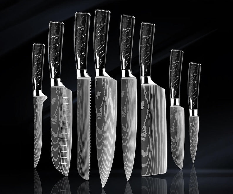 Japanese chef knife set forged from 67-layer Damascus steel with razor sharp blades and traditional ergonomic handles
