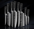 Japanese chef knife set forged from 67-layer Damascus steel with razor sharp blades and traditional ergonomic handles

