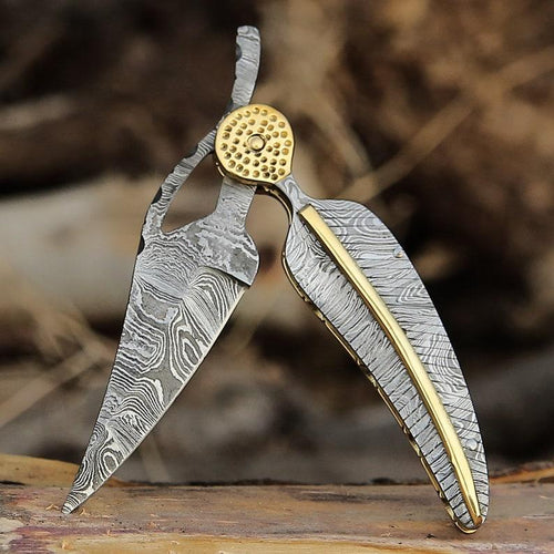 Damascus folding knife with patterned steel blade, ergonomic handle, and secure locking mechanism by Viking Hills
