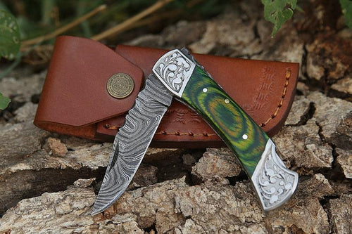Damascus folding knife with patterned steel blade, ergonomic handle, and secure locking mechanism by Viking Hills
