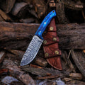 Handmade skinner knife with sharp curved steel blade and ergonomic handle for hunting and skinning tasks
