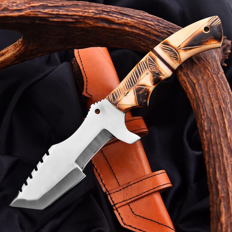 Tracker knife with full tang steel blade, durable handle, and leather sheath for outdoor survival
