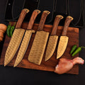 forged steel 5-piece chef knife set with patterned steel blades and ergonomic handles for professional kitchen use by Viking Hills
