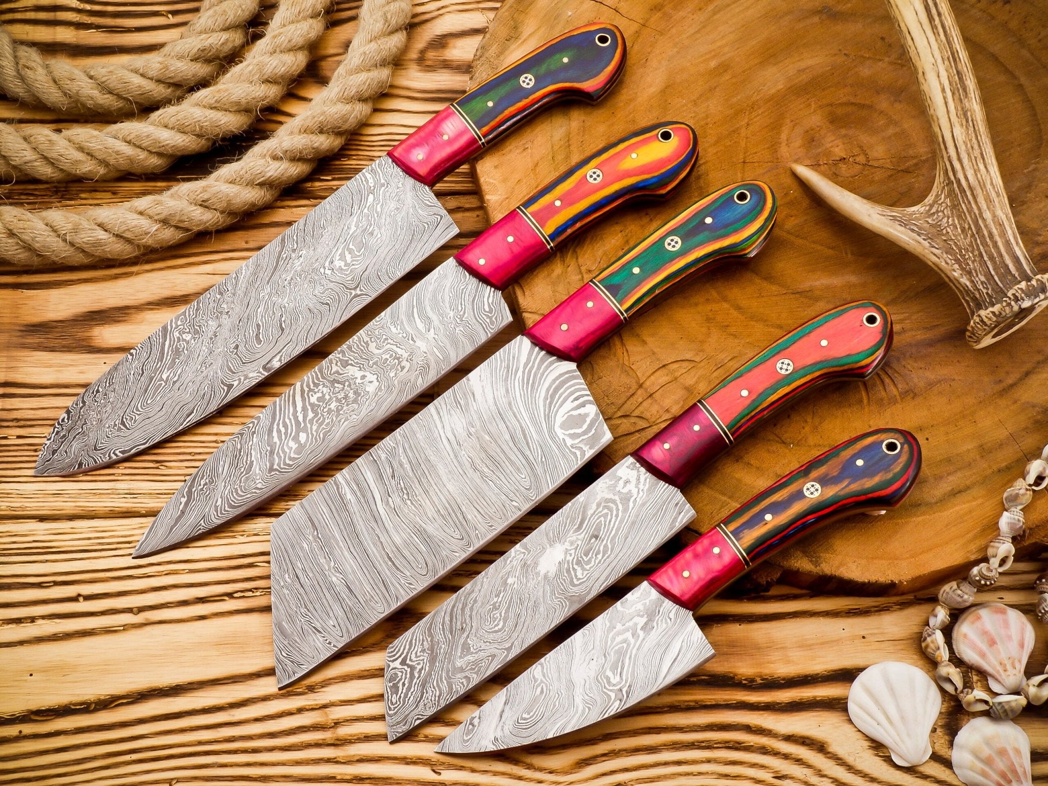 Damascus 5-piece chef knife set with patterned steel blades and ergonomic handles for professional kitchen use by Viking Hills
