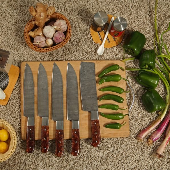 Damascus 5-piece chef knife set with patterned steel blades and ergonomic handles for professional kitchen use by Viking Hills
