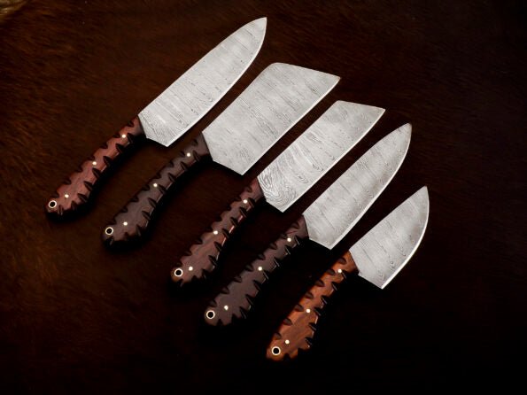 Damascus 5-piece chef knife set with patterned steel blades and ergonomic handles for professional kitchen use by Viking Hills
