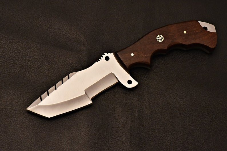 Tracker knife with full tang steel blade, durable handle, and leather sheath for outdoor survival

