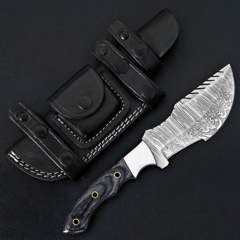 Tracker knife with full tang steel blade, durable handle, and leather sheath for outdoor survival
