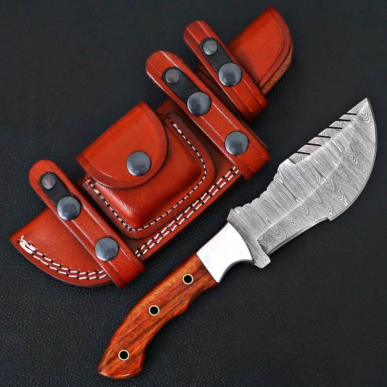 Tracker knife with full tang steel blade, durable handle, and leather sheath for outdoor survival
