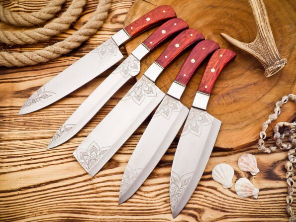 Damascus 5-piece chef knife set with patterned steel blades and ergonomic handles for professional kitchen use by Viking Hills
