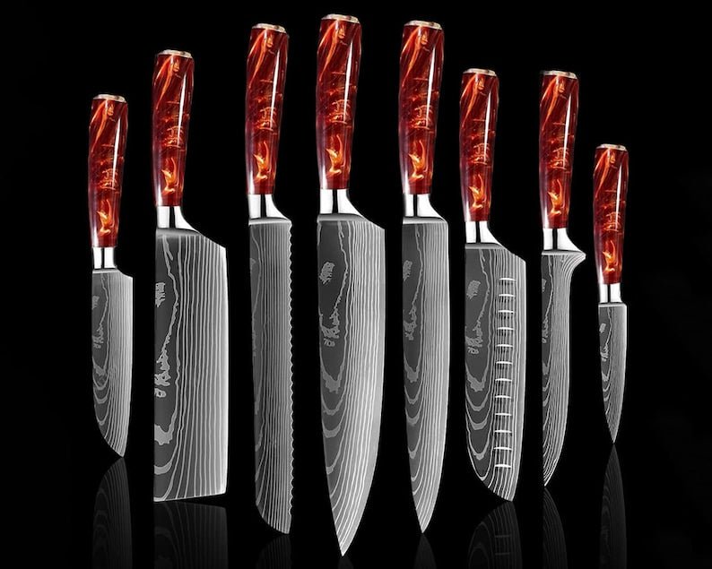 Japanese chef knife set forged from 67-layer Damascus steel with razor sharp blades and traditional ergonomic handles
